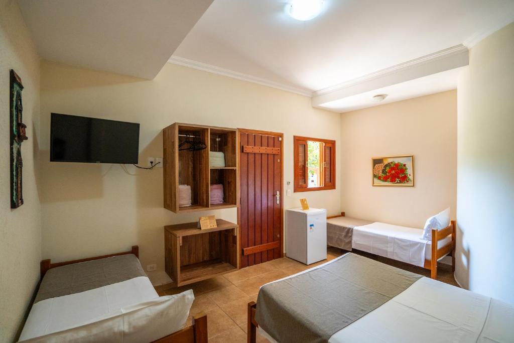 Quarto Standard Quádruplo - Pousada Galeria Artes